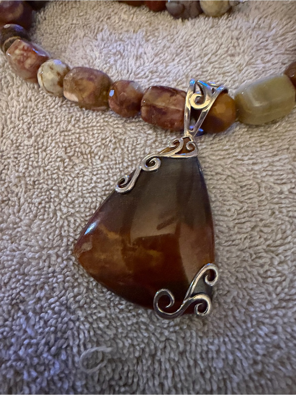 Brown Jay king Pendant Necklace with Silver Scroll Accents from